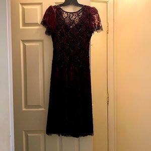 Burgundy/Black sequin dress with flutter sleeves.